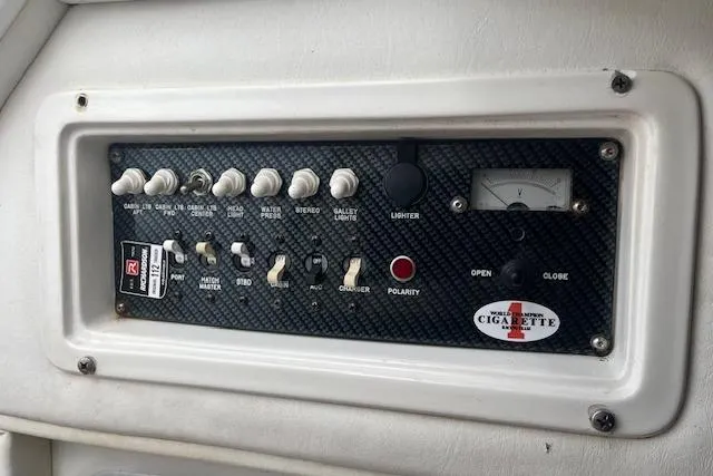 Slide: The Image of Control panel of 2000 Cigarette Top Gun T/S 38 boat with switches and voltmeter. - 9