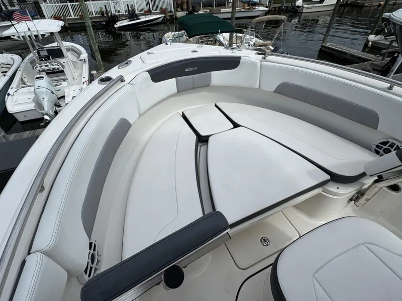 Slide: The Image of 2021 Robalo R222 Explorer boat interior with cushioned seating and sleek design. - 11