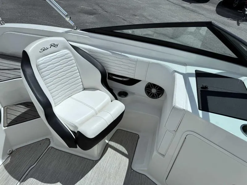 Slide: The Image of 2022 Sea Ray SPX 190 boat interior with white and black seating, modern design. - 13