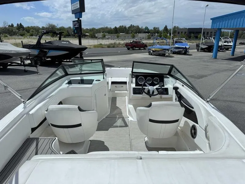 Slide: The Image of Interior view of a 2022 Sea Ray SPX 190 boat with white seating and dashboard. - 5
