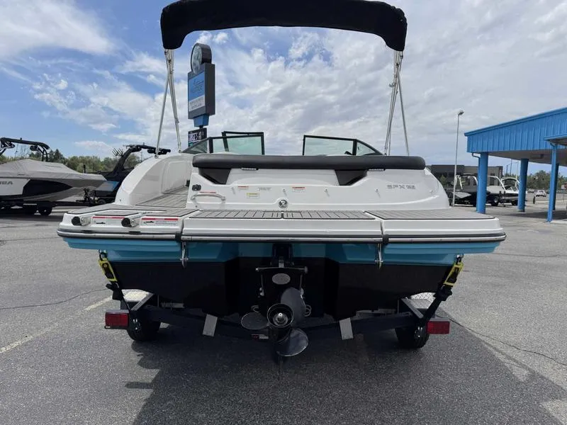 Slide: The Image of 2022 Sea Ray SPX 190 boat, rear view, on trailer in parking lot. - 8