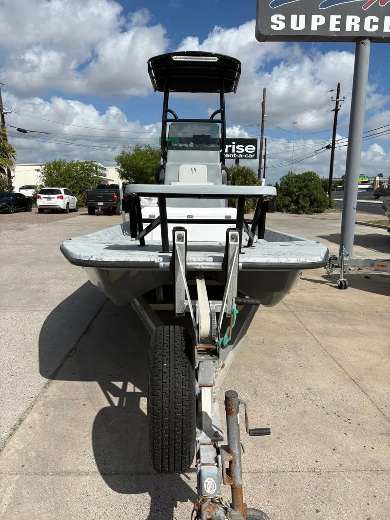 Slide: The Image of 2014 Shoalwater 21 Catamaran on trailer, parked outdoors under a blue sky. - 4