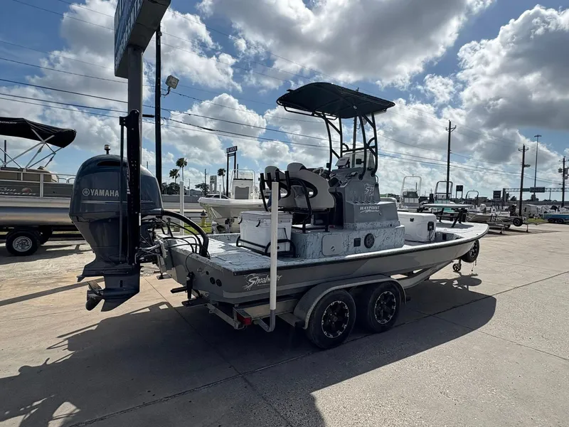 Slide: The Image of 2014 Shoalwater 21 Catamaran with Yamaha engine on trailer under cloudy sky. - 6