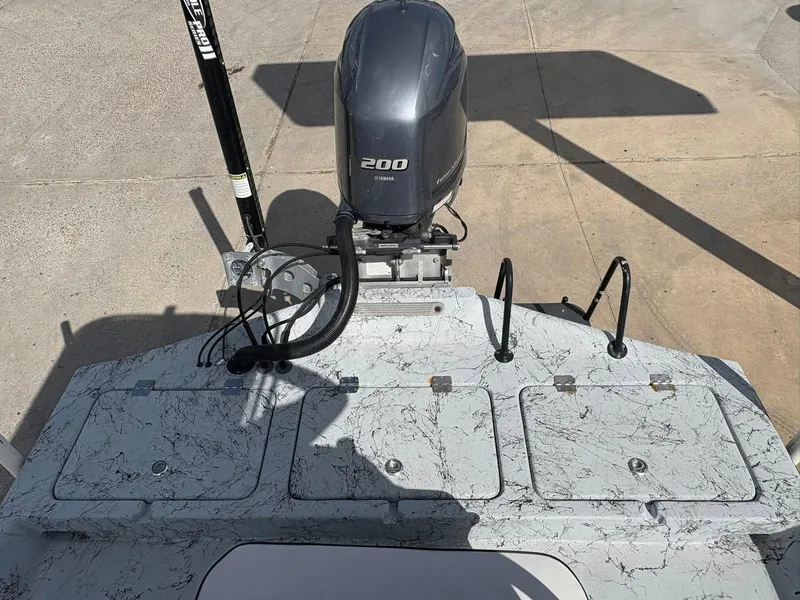 Slide: The Image of 2014 Shoalwater 21 Catamaran with Yamaha 200 engine, featuring a marbled deck design. - 7