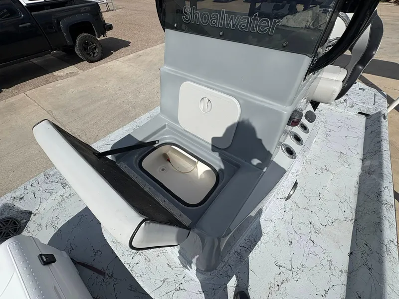 Slide: The Image of 2014 Shoalwater 21 Catamaran with open storage compartment on deck. - 9