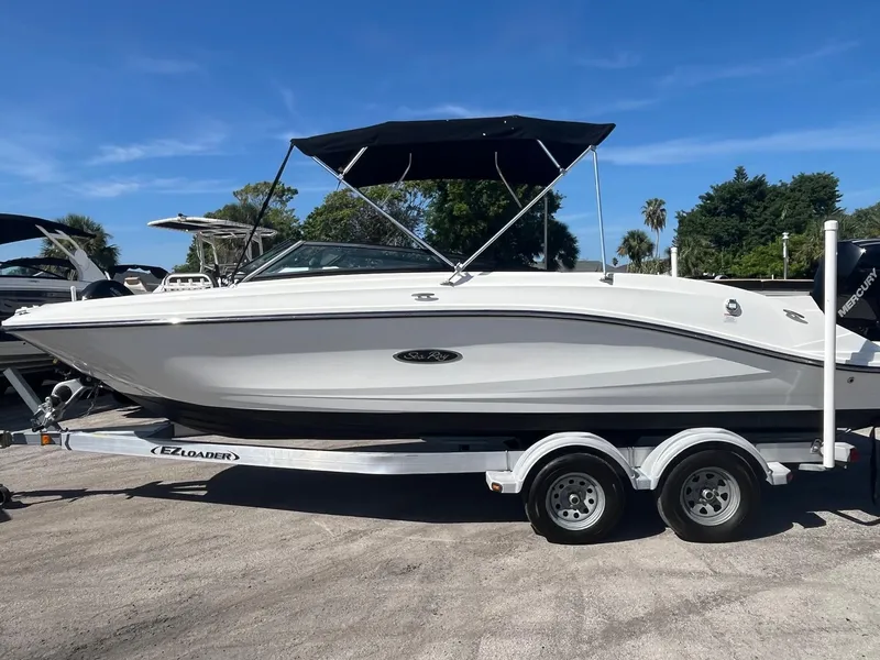 Slide: The Image of 2024 Sea Ray SPX 230 Outboard boat on trailer, sunny day, blue sky background. - 3
