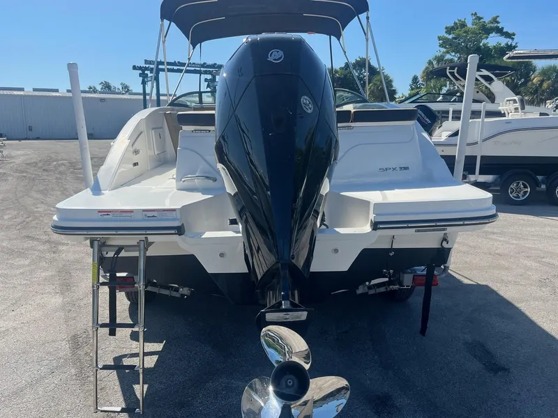 Slide: The Image of 2024 Sea Ray SPX 230 Outboard boat, rear view with motor and swim platform. - 4