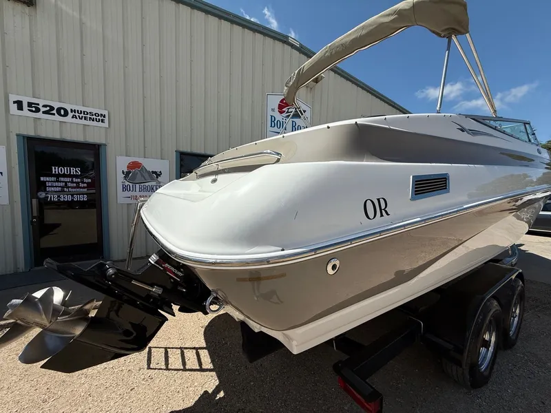 Slide: The Image of 2004 Crownline 266 BR boat on trailer outside Boji Brokers building. - 25
