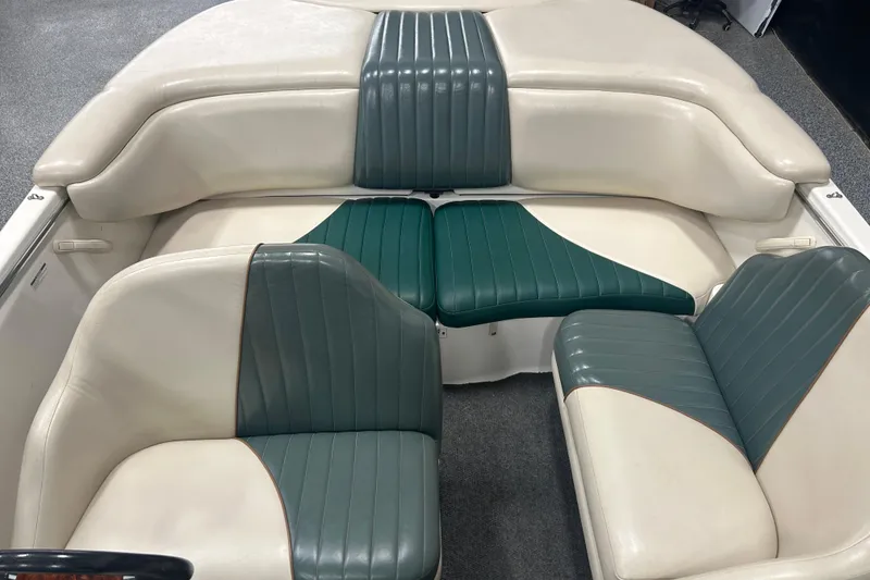 Slide: The Image of 2001 Sea-Doo Utopia 185 boat interior with green and white seating arrangement. - 10