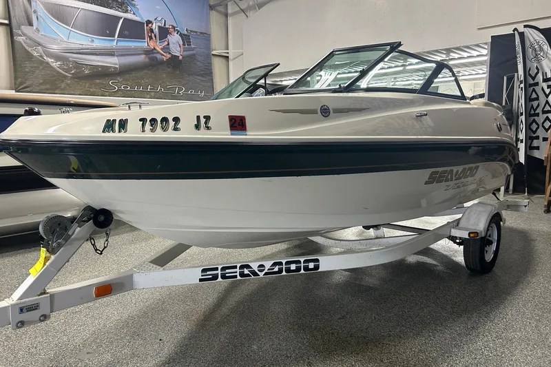 Slide: The Image of 2001 Sea-Doo Utopia 185 boat on trailer in showroom setting. - 2