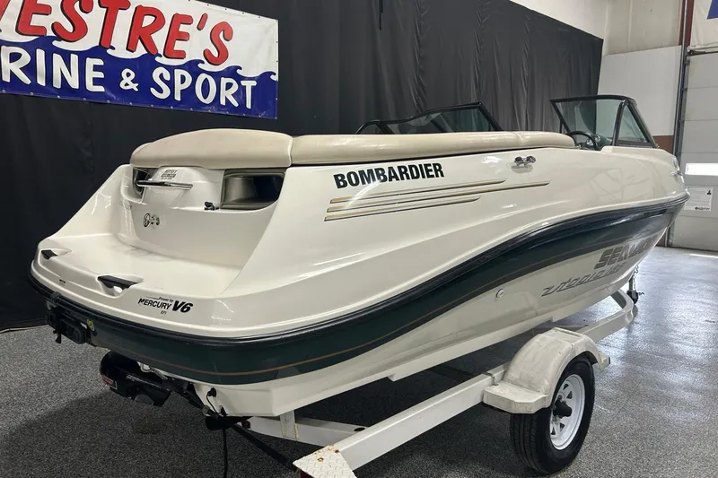 Slide: The Image of 2001 Sea-Doo Utopia 185 boat on trailer, displayed indoors. - 4
