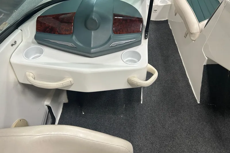 Slide: The Image of Interior of a 2001 Sea-Doo Utopia 185 boat with cup holders and seating. - 7