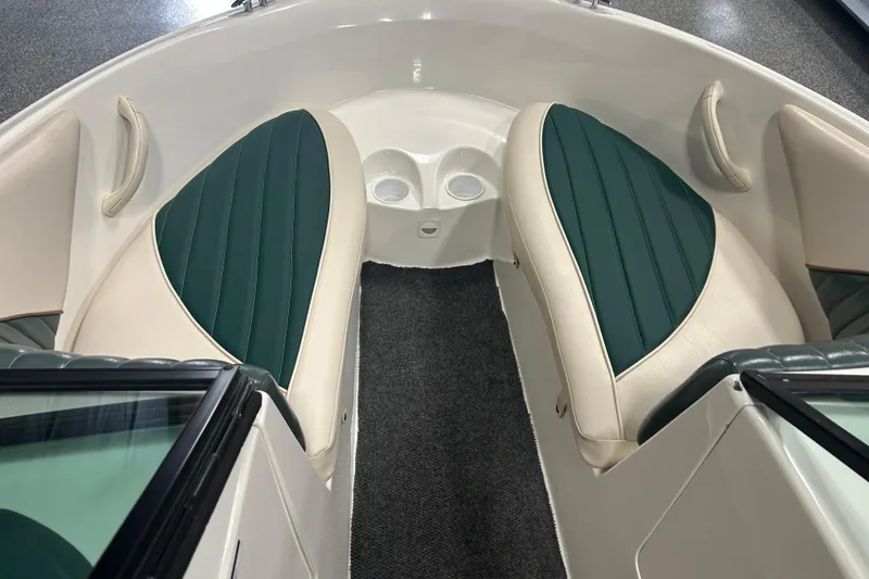 Slide: The Image of 2001 Sea-Doo Utopia 185 boat interior with green and beige seating. - 8