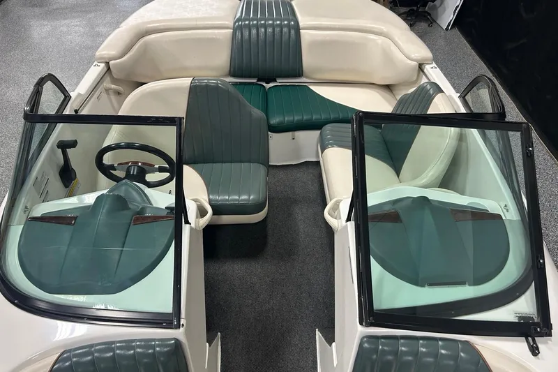 Slide: The Image of 2001 Sea-Doo Utopia 185 boat interior with green and white seating. - 9