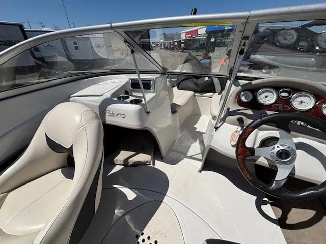 Slide: The Image of 2014 Tracker Tahoe Q5 boat interior with steering wheel, dashboard, and seating. - 11