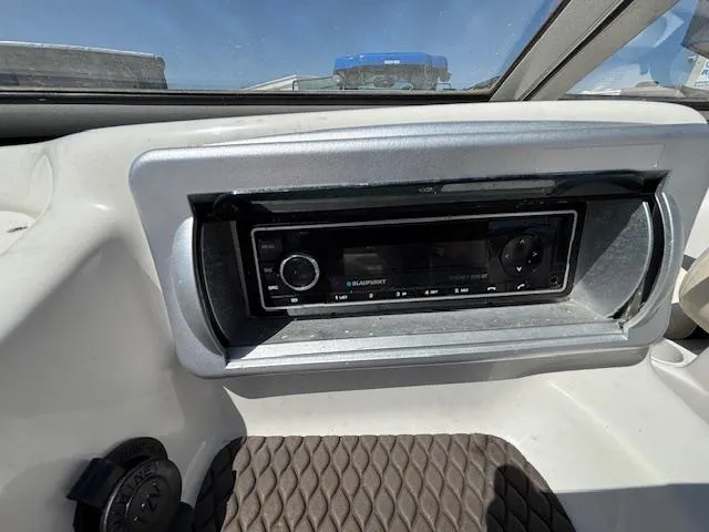 Slide: The Image of Dashboard of 2014 Tracker Tahoe Q5 featuring Blaupunkt stereo system. - 12