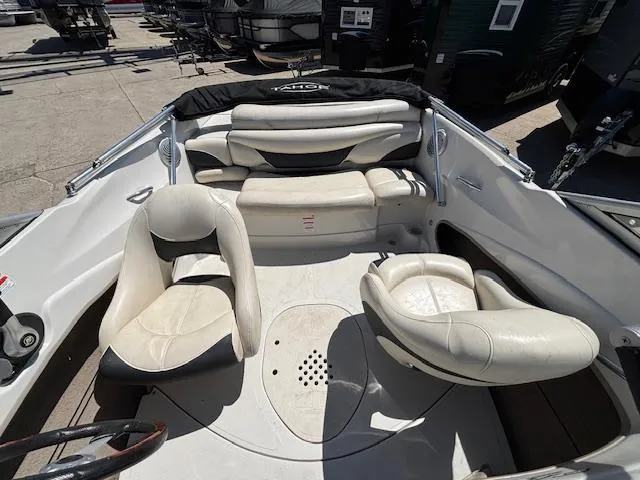 Slide: The Image of 2014 Tracker Tahoe Q5 boat interior with white seating and steering wheel. - 15