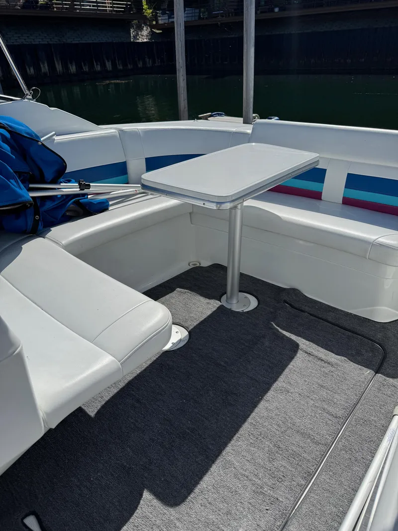 Slide: The Image of Interior of a 1996 Formula 280 SS boat with seating and table. - 11
