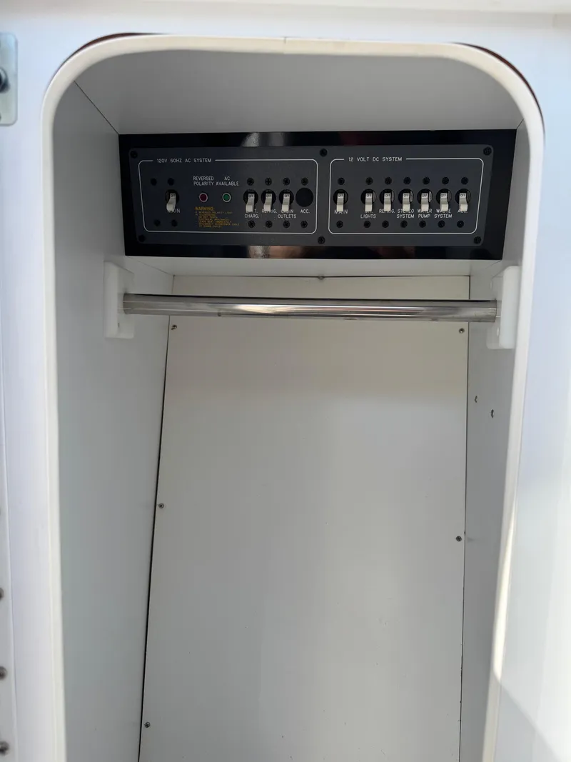 Slide: The Image of Electrical panel inside a 1996 Formula 280 SS boat compartment. - 21