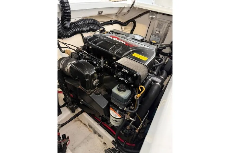 Slide: The Image of Engine of a 1996 Formula 280 Sun Sport boat, featuring MerCruiser EFI system. - 28