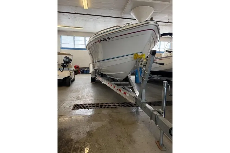 Slide: The Image of 1996 Formula 280 Sun Sport boat on trailer in indoor storage facility. - 36
