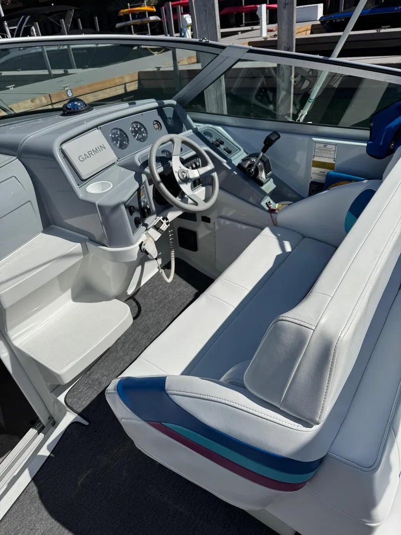 Slide: The Image of 1996 Formula 280 SS boat interior with Garmin navigation, white seating, and control panel. - 6