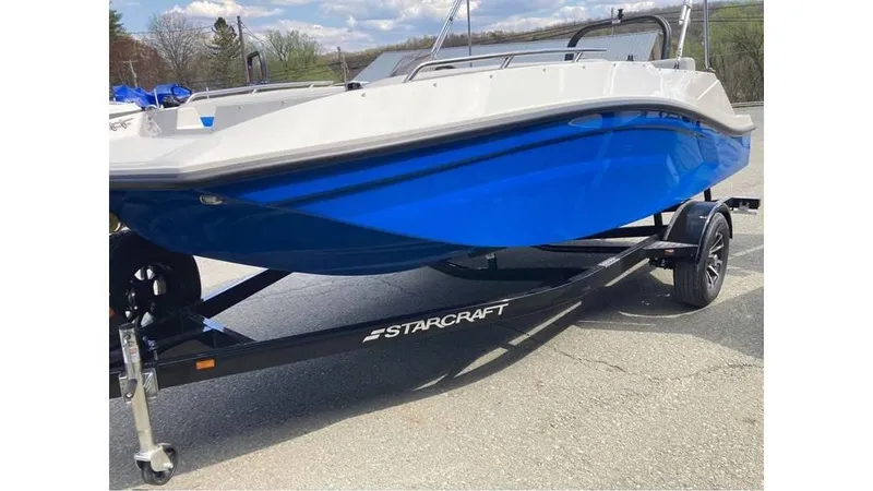 Slide: The Image of 2025 Starcraft SV 16 OB boat with blue hull on a trailer. - 3