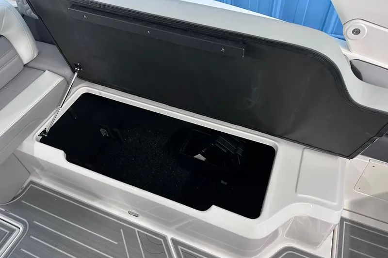 Slide: The Image of Open storage compartment in 2026 Regal LX9 boat, featuring sleek interior design. - 10
