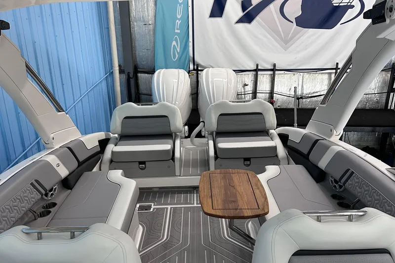 Slide: The Image of Luxurious 2026 Regal LX9 boat interior with sleek seating and wooden table. - 27