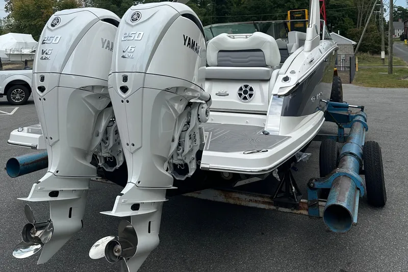 Slide: The Image of 2026 Regal LX9 boat with twin Yamaha 250 V6 outboard engines on a trailer. - 30