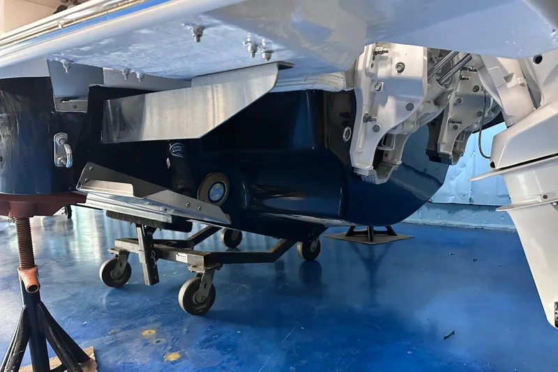 Slide: The Image of 2026 Regal LX9 boat hull and engine components in a workshop setting. - 31