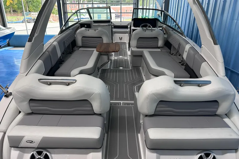 Slide: The Image of 2026 Regal LX9 boat interior with sleek gray seating and modern design. - 5