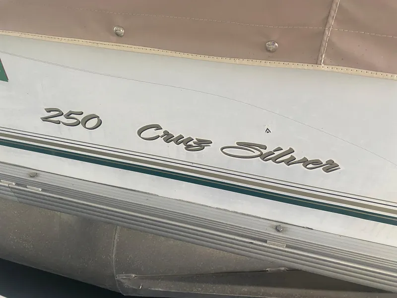 Slide: The Image of 2008 Sunset Bay Cruz 250 boat with 'Cruz Silver' lettering on the side. - 3