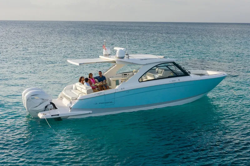 Slide: The Image of Manufacturer Provided Image: 2022 Regal LX36 boat cruising on clear blue water with passengers. - 26