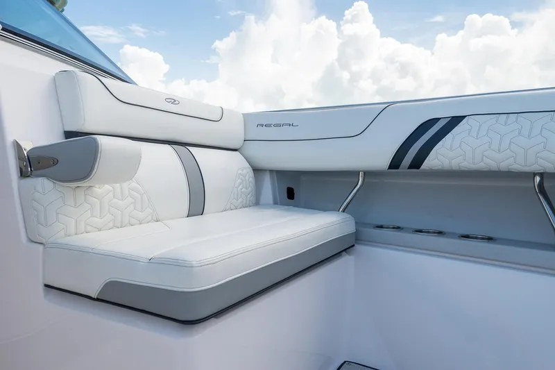 Slide: The Image of Manufacturer Provided Image: Luxurious seating on the 2022 Regal LX36 boat with white and gray upholstery. - 32