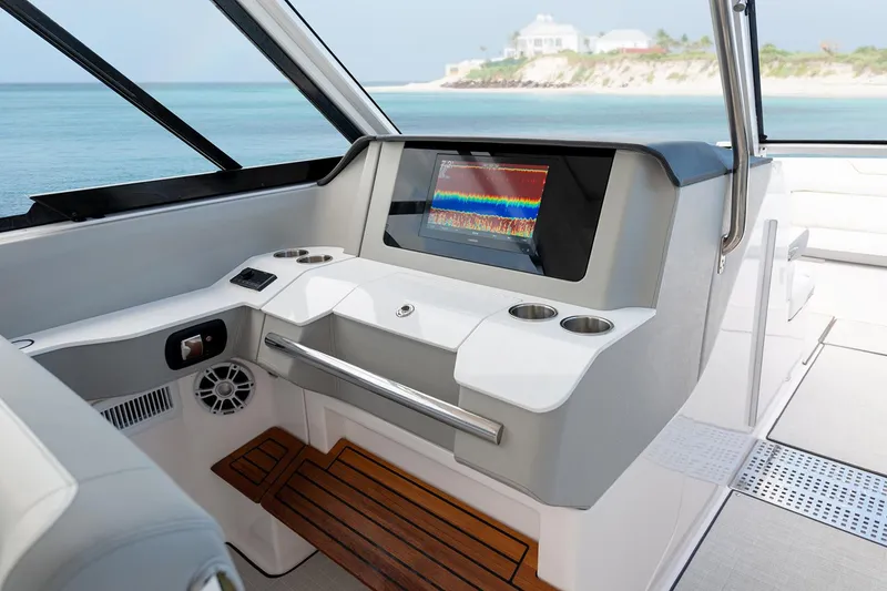 Slide: The Image of Manufacturer Provided Image: 2022 Regal LX36 boat helm with advanced navigation system and ocean view. - 36