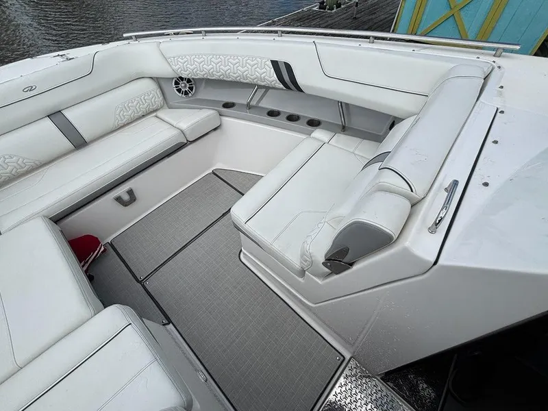 Slide: The Image of Luxurious seating area on a 2022 Regal LX36 boat, featuring elegant white upholstery. - 4