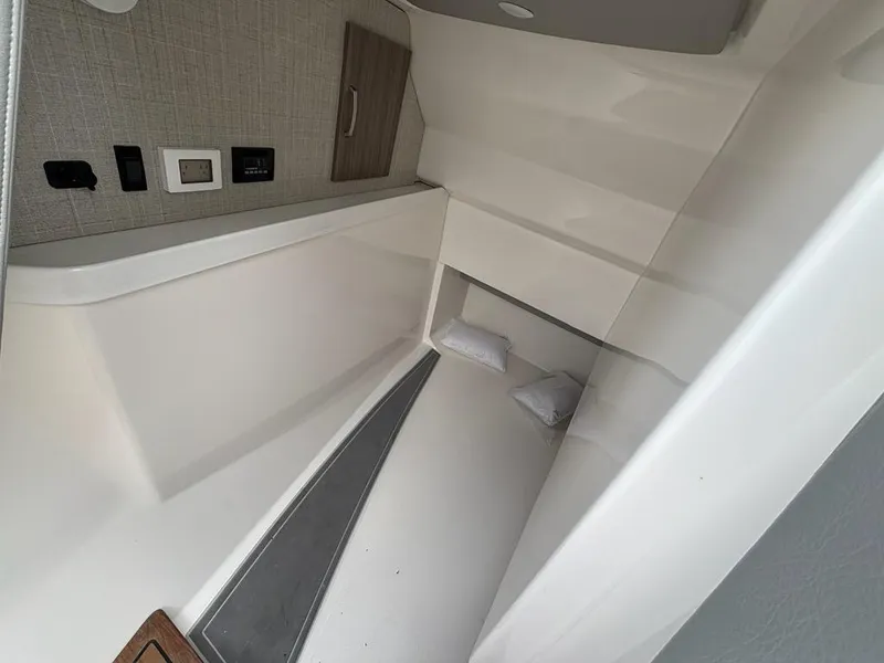 Slide: The Image of 2022 Regal LX36 cabin interior with modern design and comfortable bedding. - 6