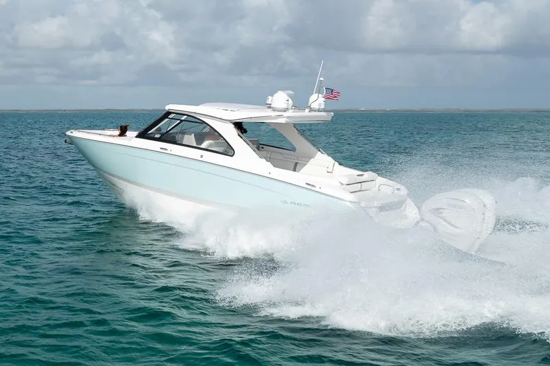 Slide: The Image of Manufacturer Provided Image: 2022 Regal LX36 boat cruising on open water. - 8