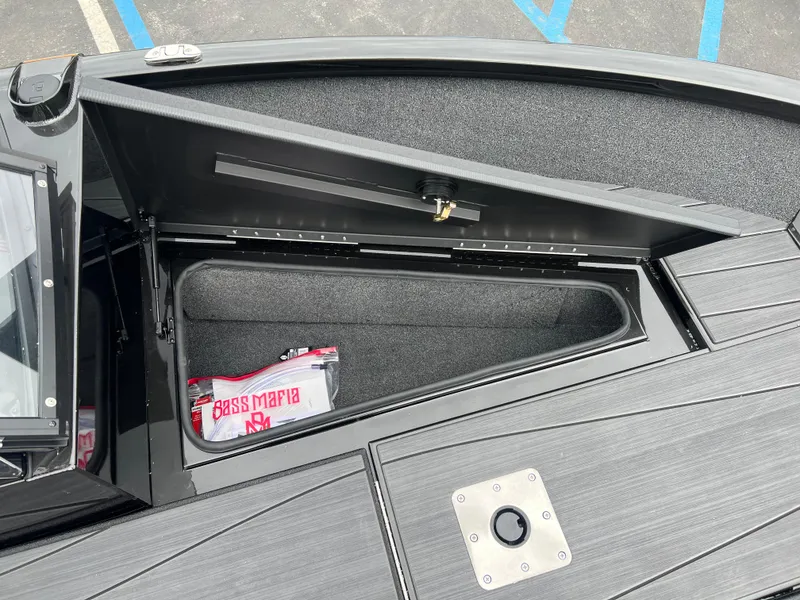 Slide: The Image of Open storage compartment on 2025 Vexus ADX 200 boat, showcasing interior space and design. - 10