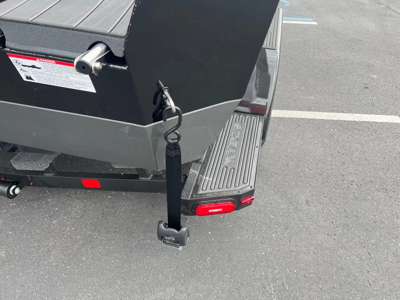 Slide: The Image of Rear view of 2025 Vexus ADX 200 boat trailer with safety strap and step. - 5