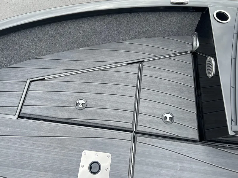 Slide: The Image of 2025 Vexus ADX 200 boat deck with sleek, modern design and storage compartments. - 8