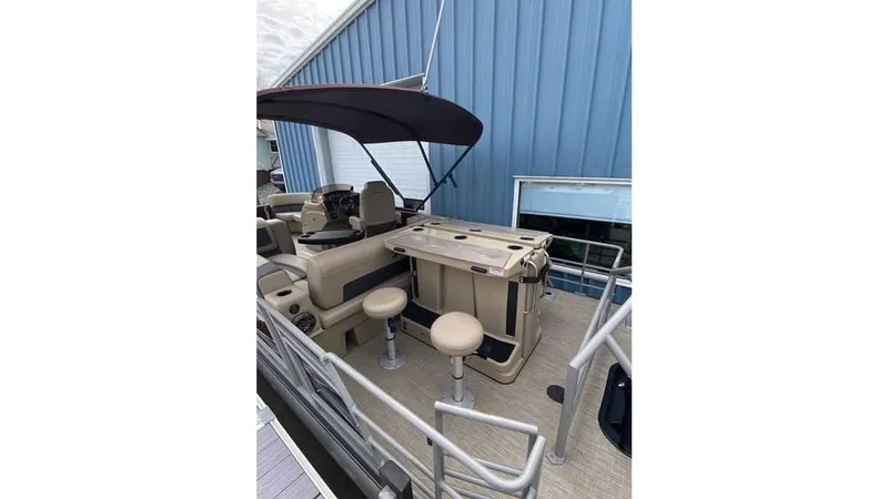 Slide: The Image of 2024 Starcraft CX 23 DL BAR pontoon boat with bar seating and canopy. - 4