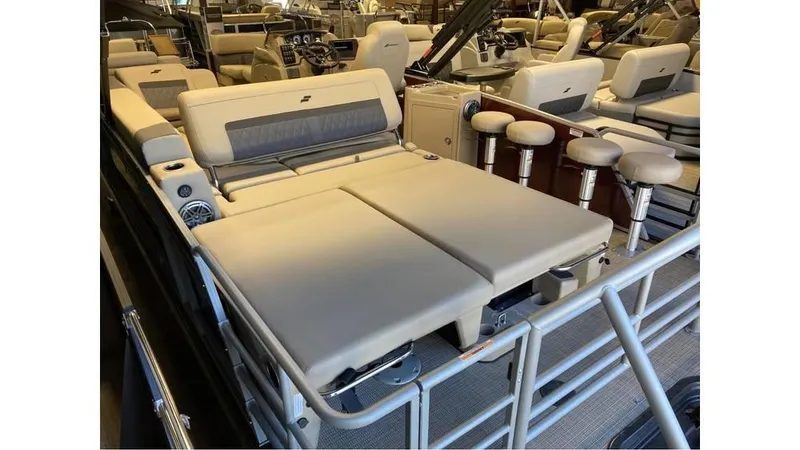 Slide: The Image of 2024 Starcraft CX 23 DL BAR pontoon boat with luxurious seating and bar stools. - 6