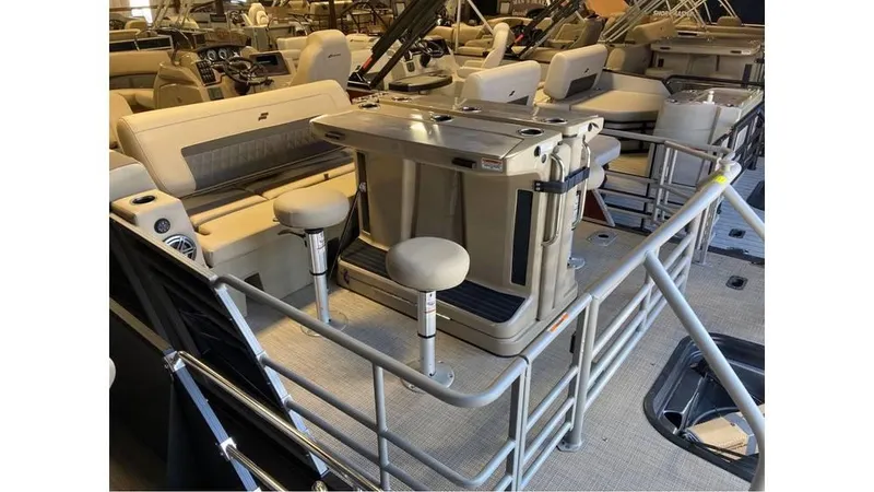 Slide: The Image of 2024 Starcraft CX 23 DL BAR pontoon boat interior with seating and bar area. - 8