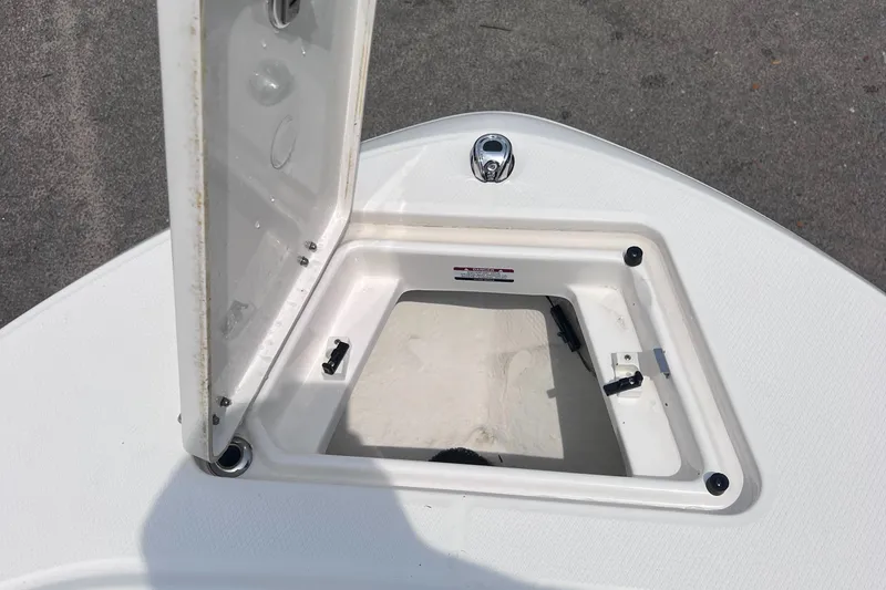 Slide: The Image of Open storage compartment on 2024 Robalo R200 Center Console boat. - 16