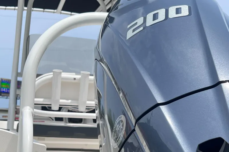 Slide: The Image of 2024 Robalo R200 Center Console boat engine close-up, showcasing sleek design and power. - 5