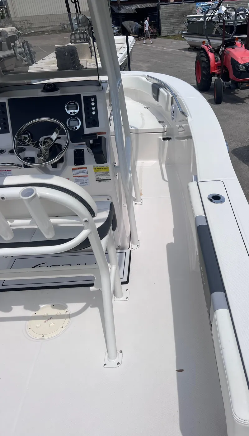 Slide: The Image of 2024 Robalo R200 Center Console boat interior with steering wheel and seating. - 6