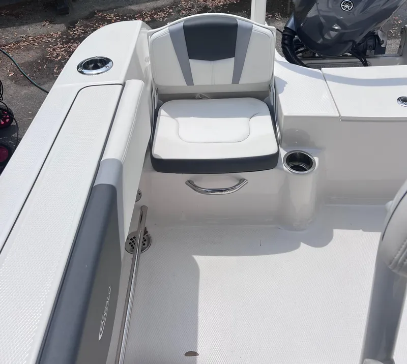 Slide: The Image of 2024 Robalo R200 Center Console boat interior with cushioned seating and cup holder. - 7