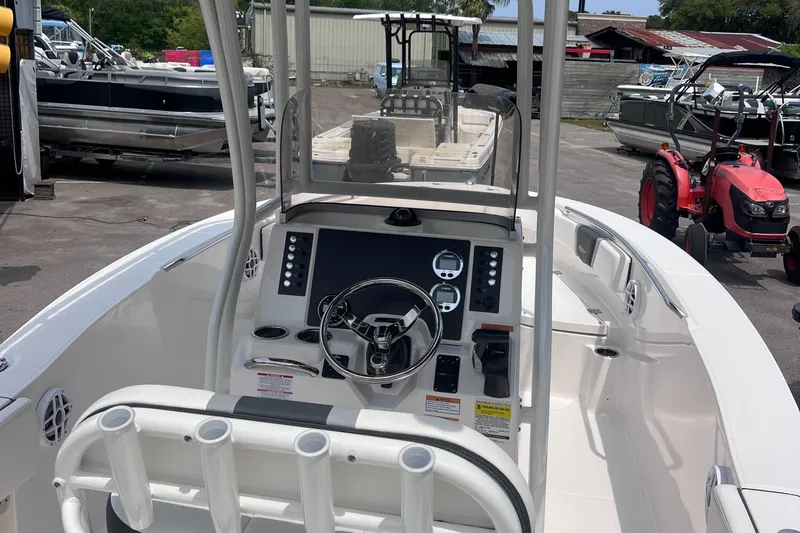 Slide: The Image of 2024 Robalo R200 Center Console boat interior with steering wheel and control panel. - 8